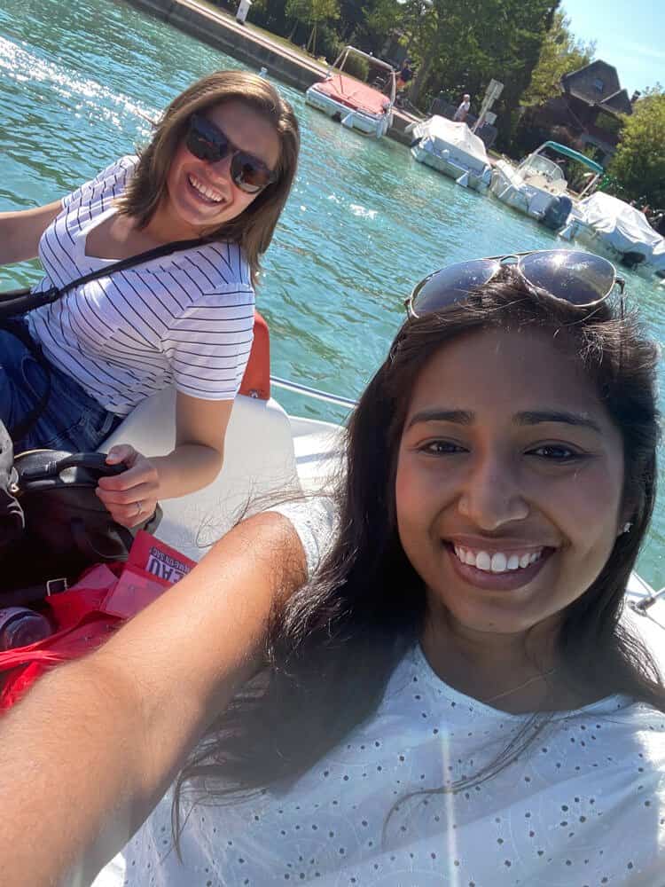 Kat and Mounika on a paddle boat in Annecy