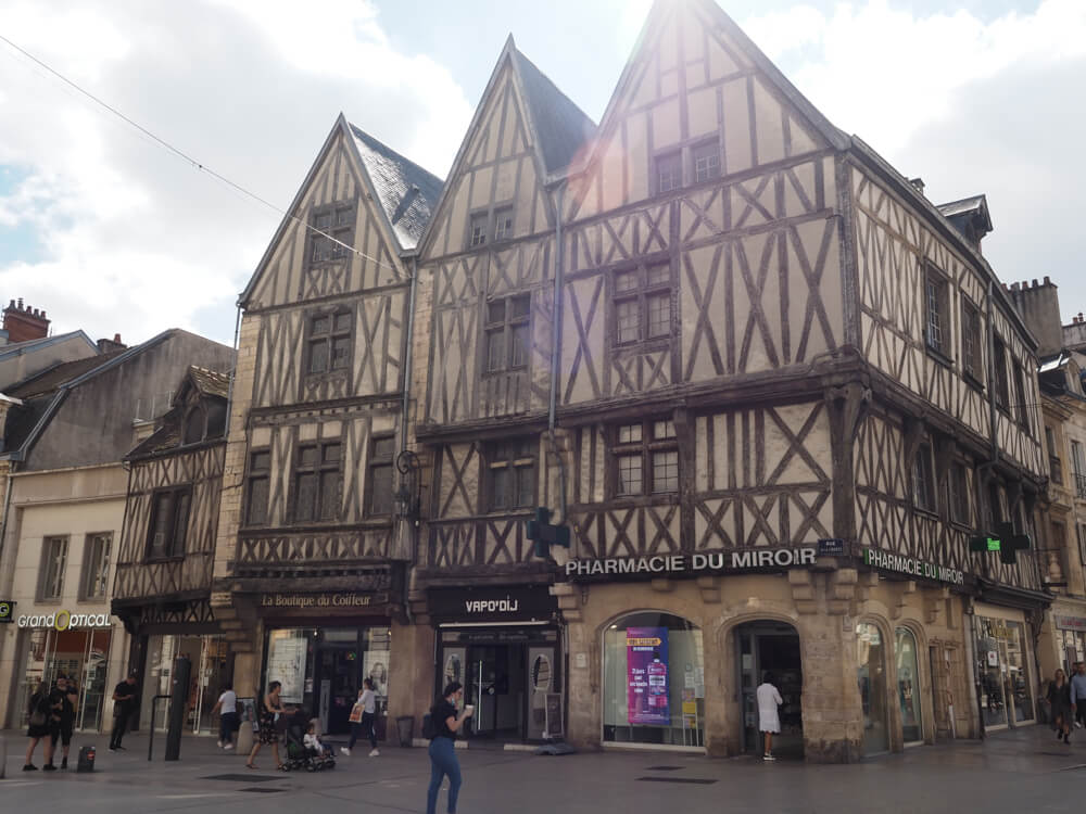 Medieval building with a pharmacy at the bottom in Dijon