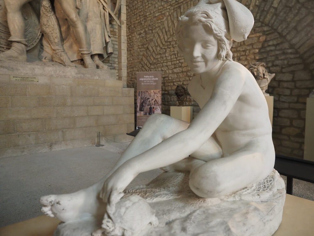 Statue of a boy at Musee Rude in Dijon