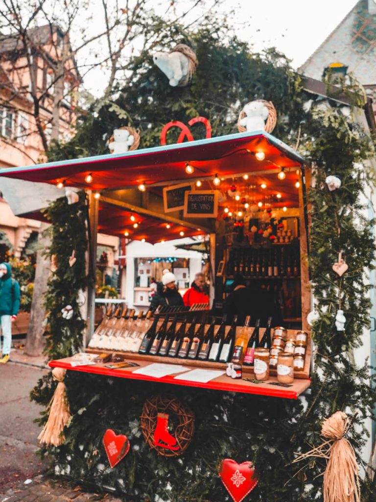 Greenery covered booth at the Colmar Christmas Market