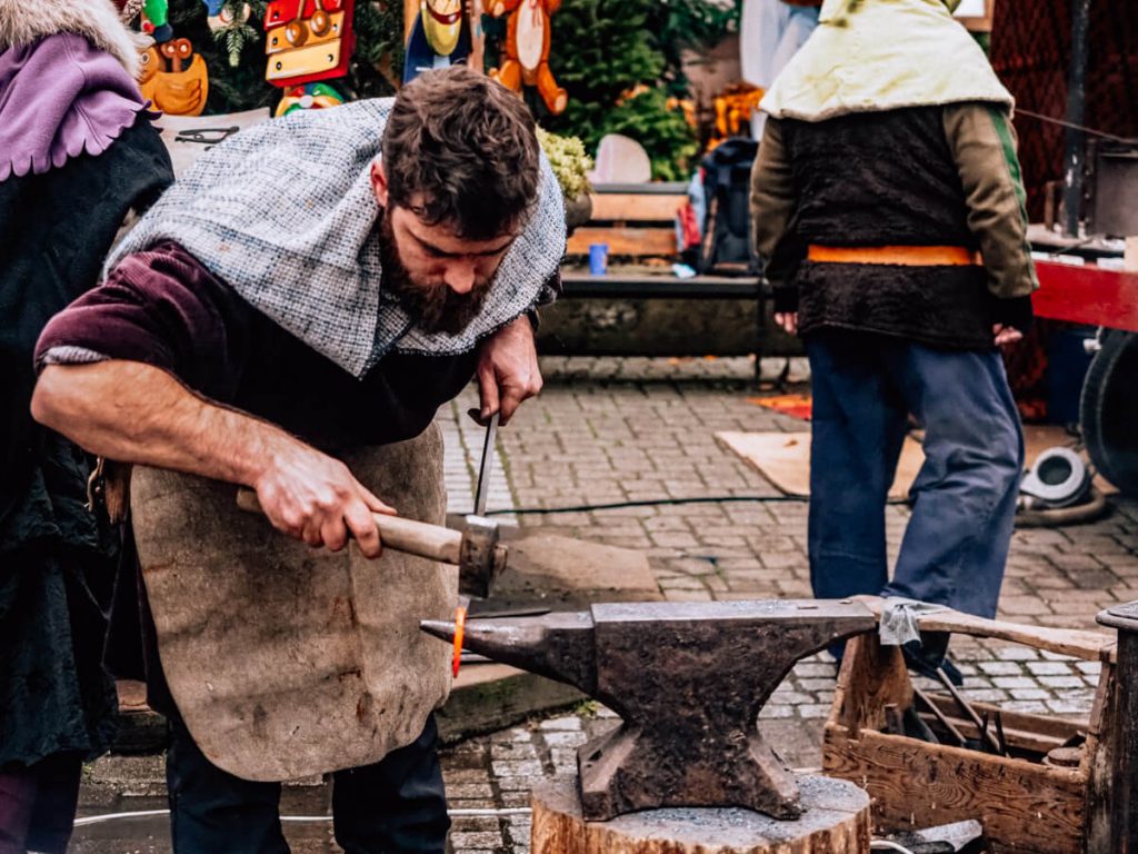 Man blacksmithing in Ribeauville Medieval Market