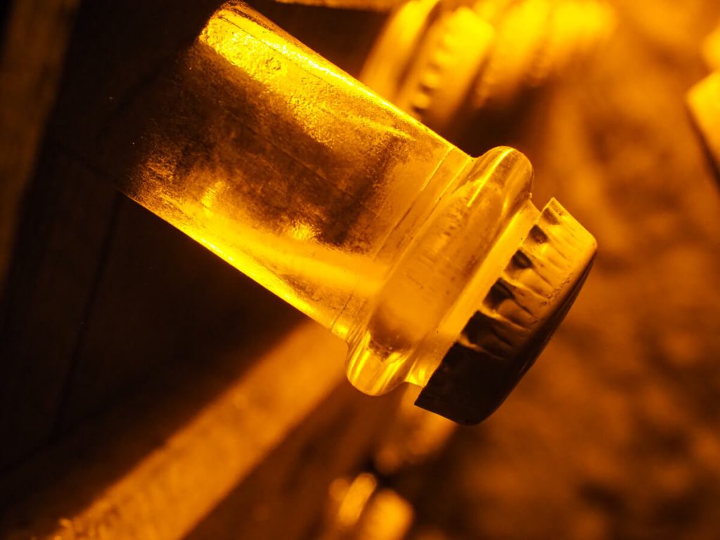 Close up of lees in the neck of the Champagne Bottle