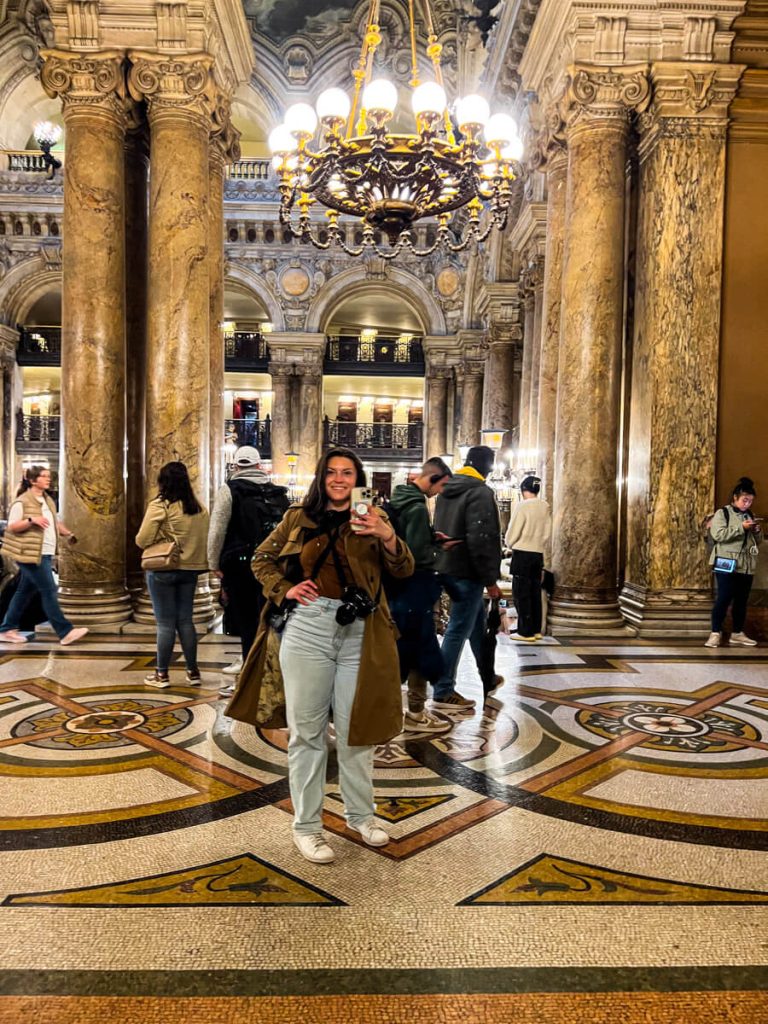 Kat taking a mirror selfie at the Palais Garnier