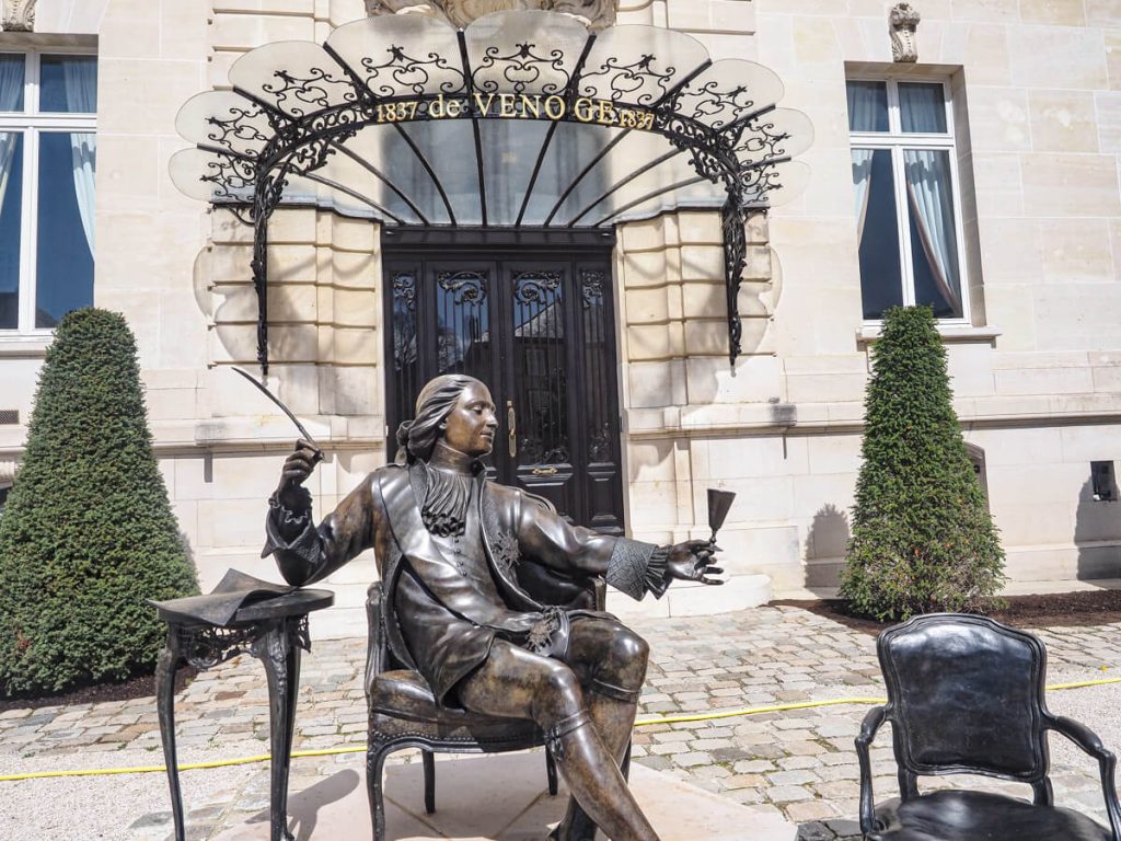 Statue of perfect with Champagne Glass at Chateau de Venoge