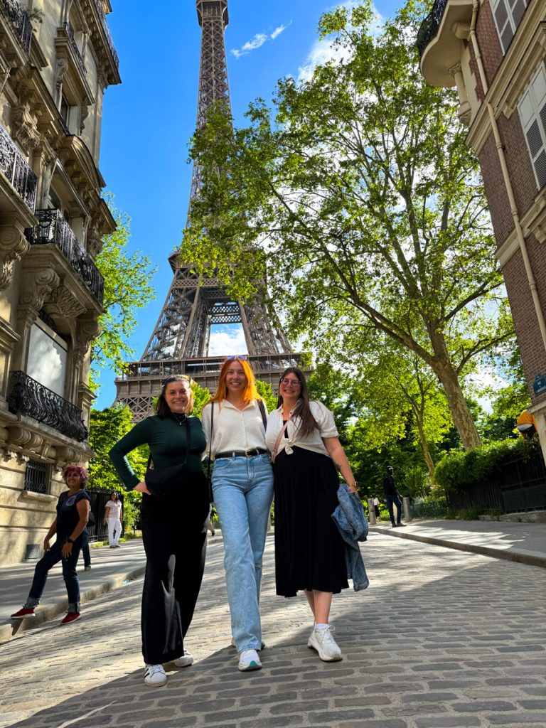Kat, Megan, and Amanda in front of the Eiffel Tower on Rue de l'Universite 2