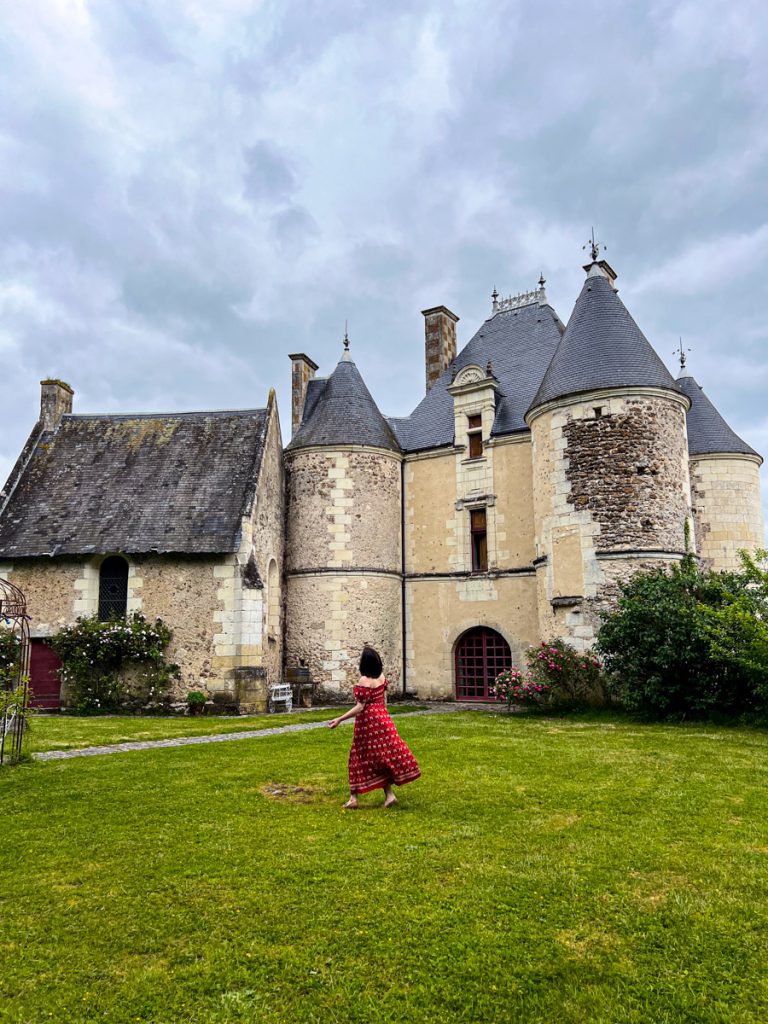 Kat in front of the Chateau Airbnb 6