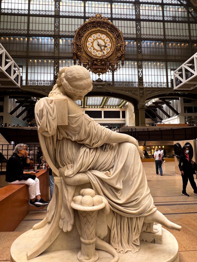 Statue and clock in Musee d'Orsay