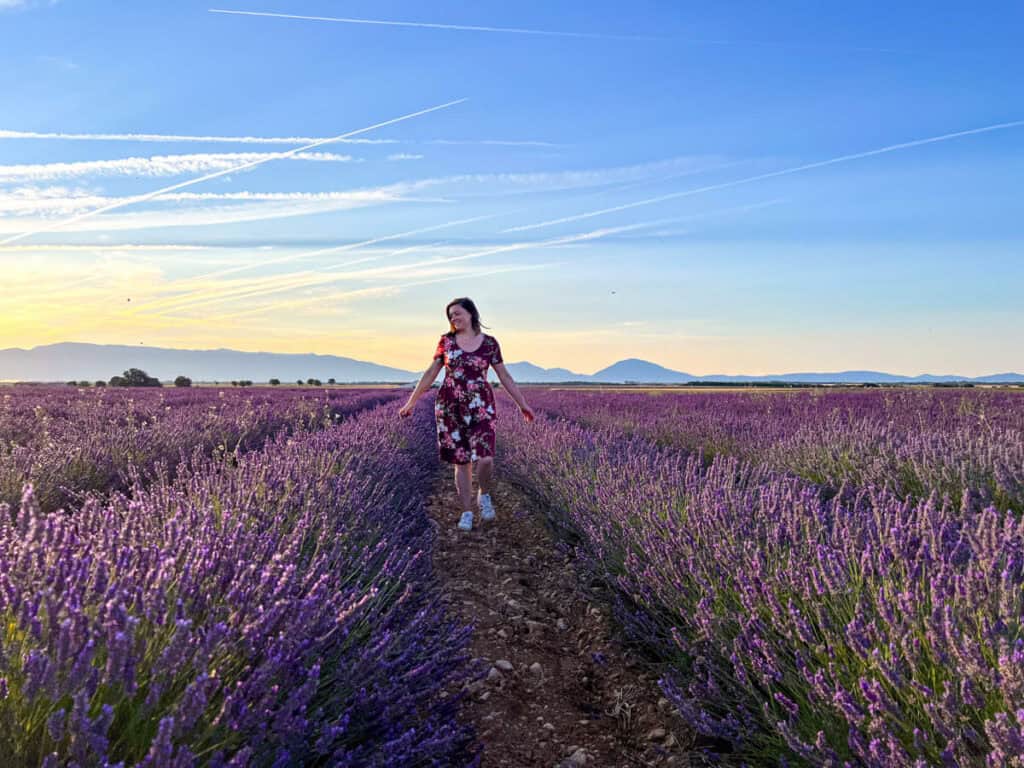 Kat walking through a sunflower field in Valensole