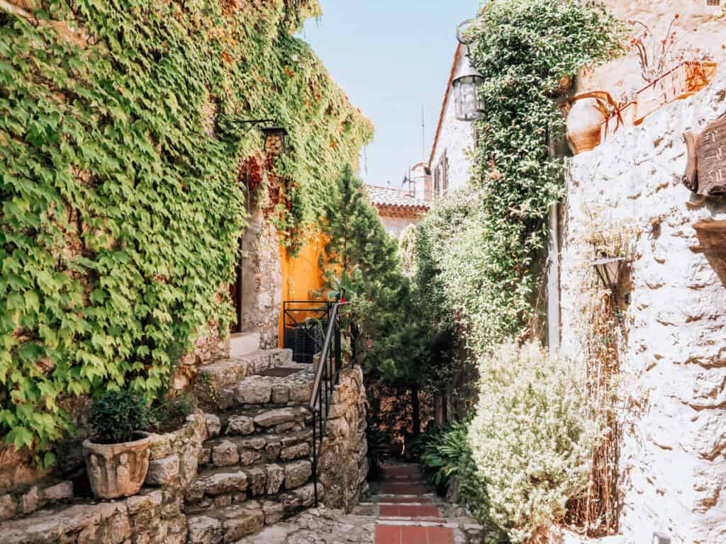Greenery covered building on the street in Eze