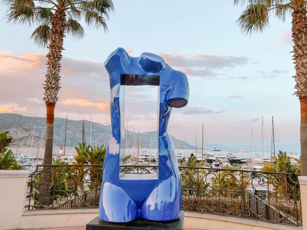 Saint-Jean-Cap-Ferrat port statue of a blue woman shape with the center cut out like a window 2