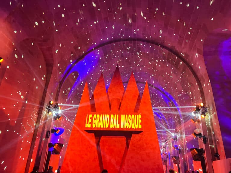 Entrance to the Grand Masked Ball of Versailles sign