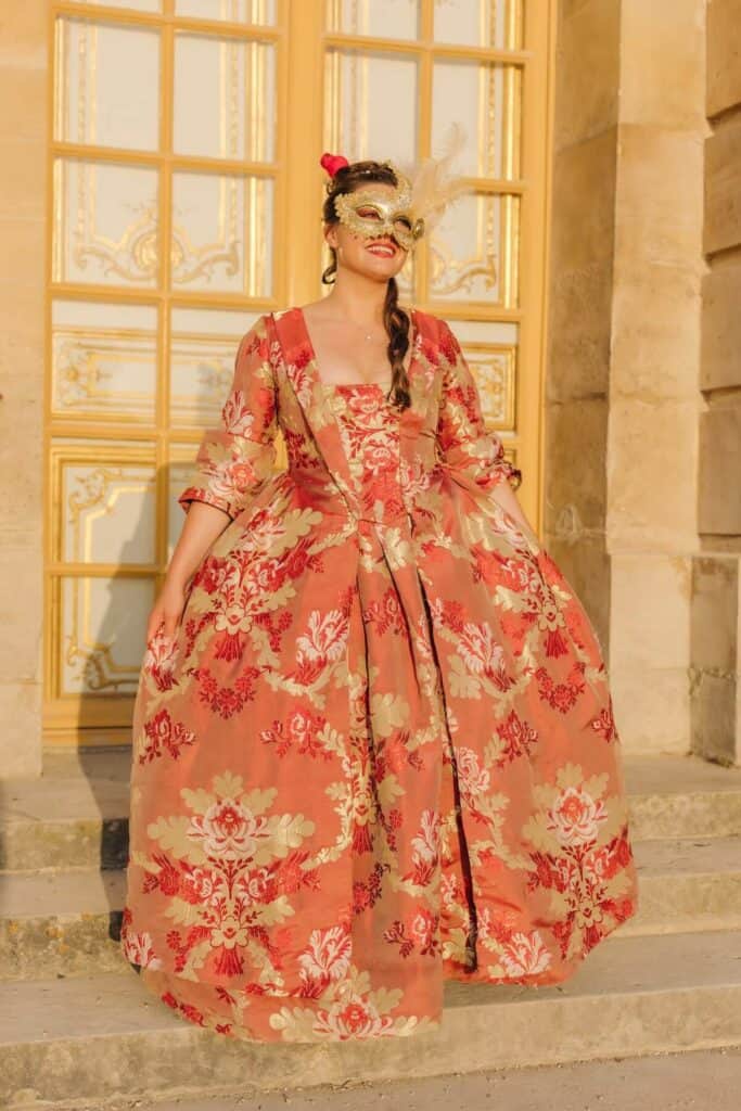 Kat in her costume and mask at Versailles