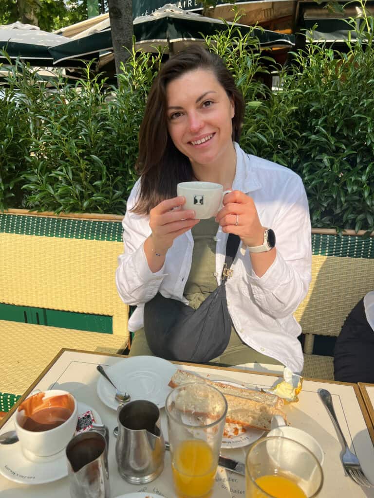 Kat with her hot chocolate at Les Deux Magots
