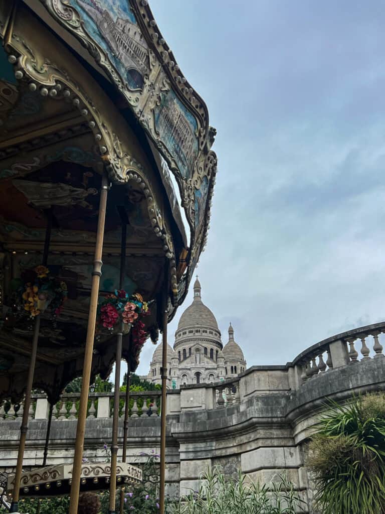 Montmartre with the carousel in the foreground with Sacre Coeur in the back